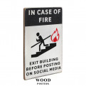 Постер "In case of fire exit building before posting on social media"