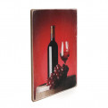 Постер "Пляшка червоного вина з келихом і виноградом. Червоний фон"